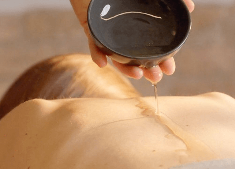 Massage oil being applied at Toronto spa Pamper Valley